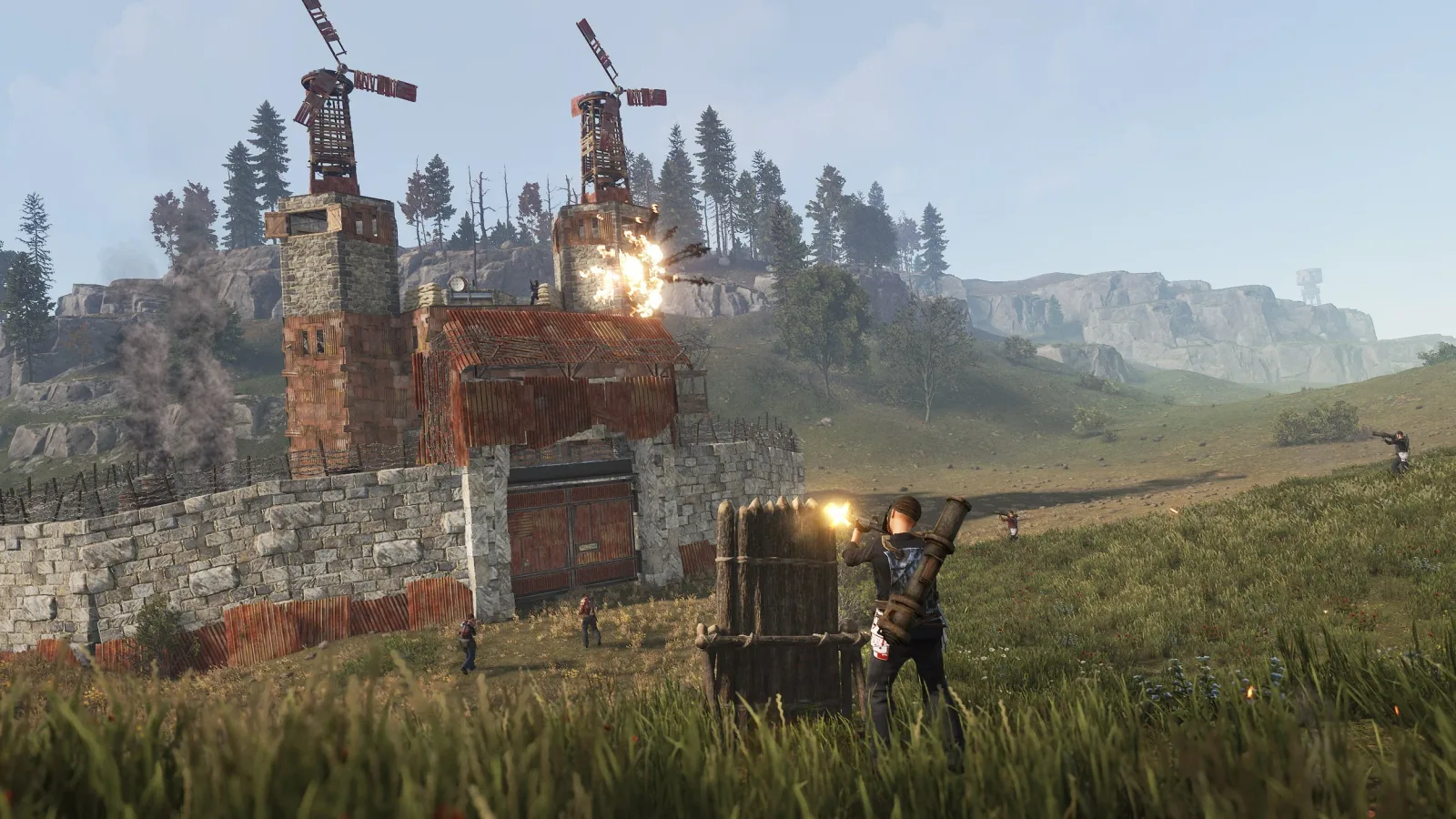 Players attacking a base during a raid in Rust.