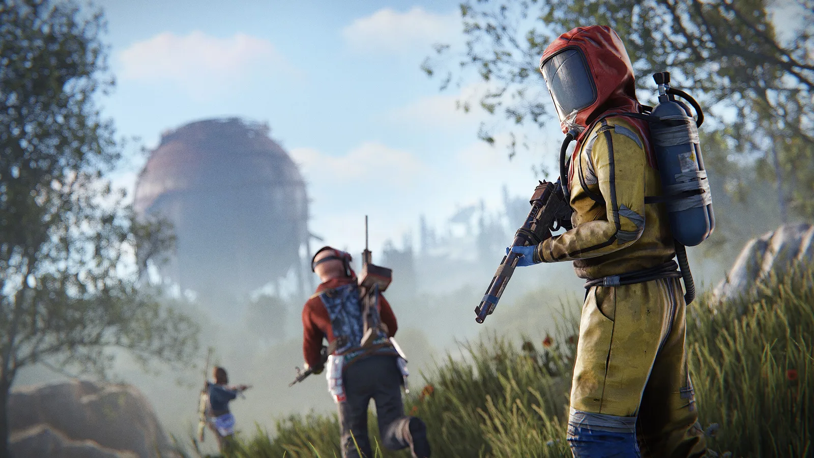 Armed survivors in protective gear moving through a grassy industrial area in Rust.